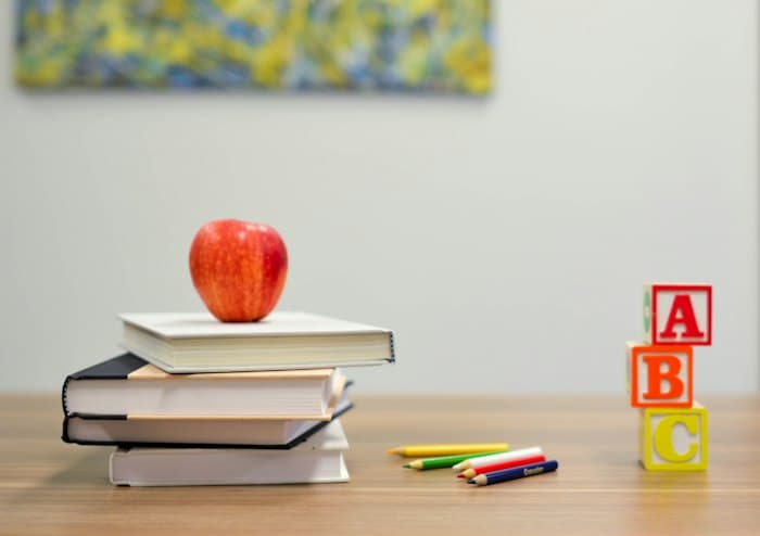 Books and alphabet blocks on a desk