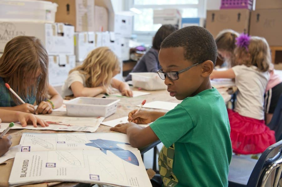 Pupils drawing and writing