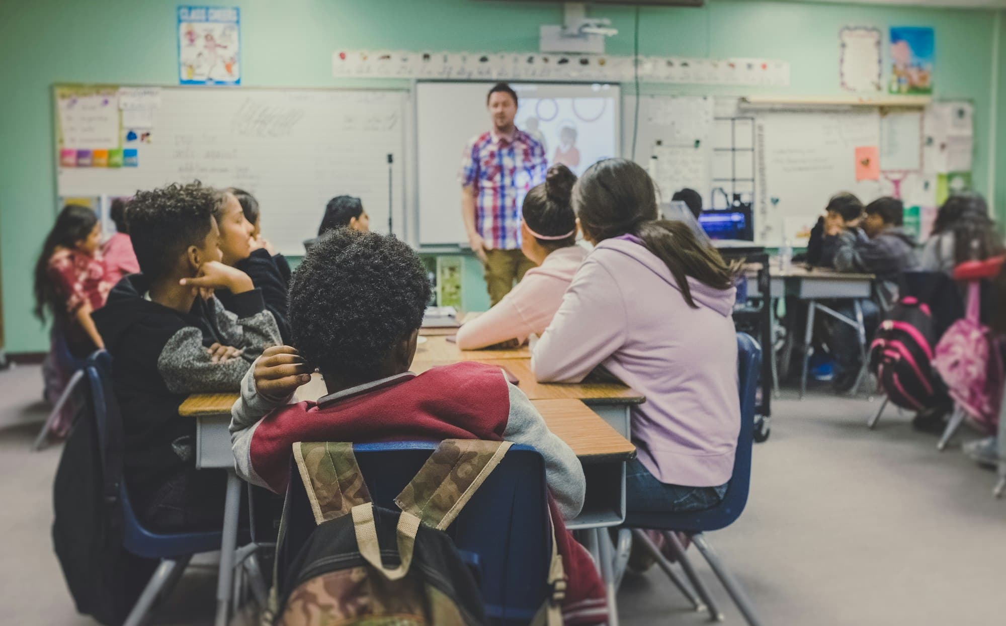 Pupils learning in a bright classroom